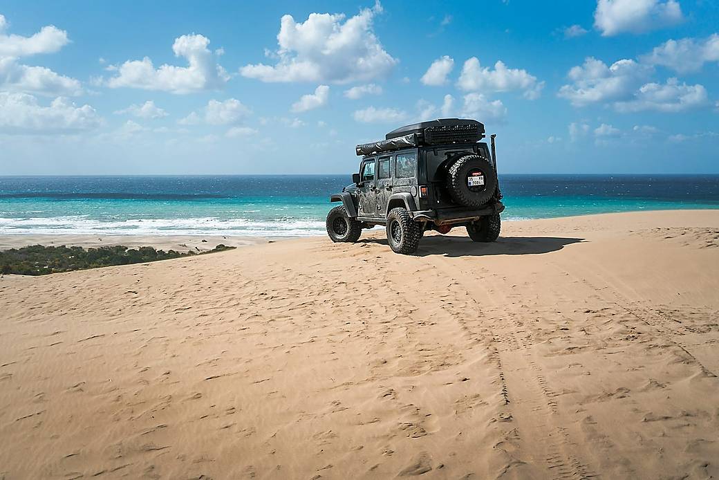 A jeep on an off-road tropical track
